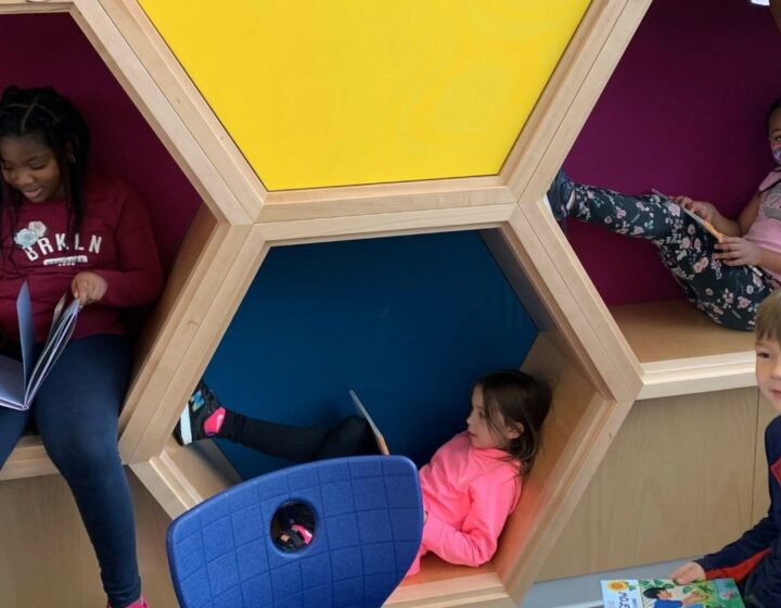 SD 60 elementary students reading books in their pods.