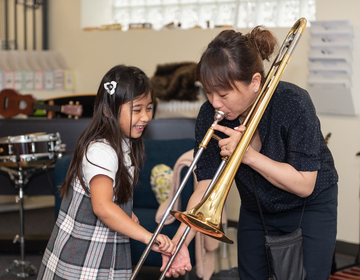 Stratford Hall Band Teacher and Student playing Trombone